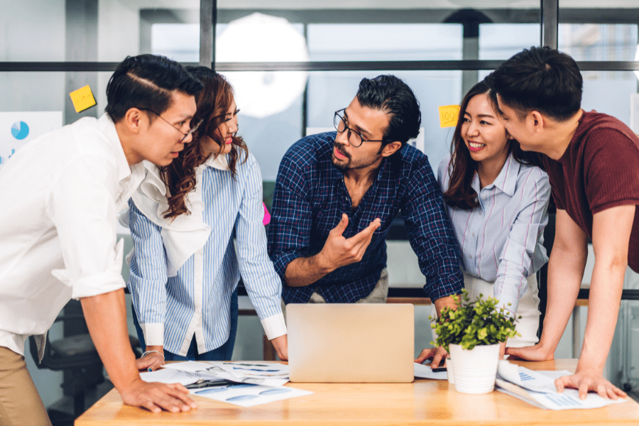 A group of employees having a team meeting at a fintech recruitment company