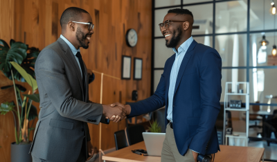 ceo of a fintech company shaking hands with new employee